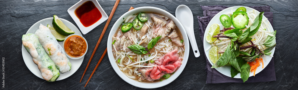 Vietnamese noodle meal served with a cold tea drink